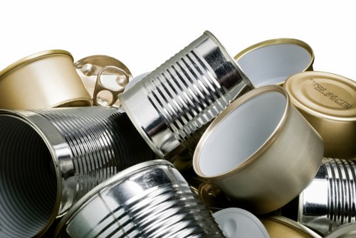 Team members consulting risk assessment before loading a skip